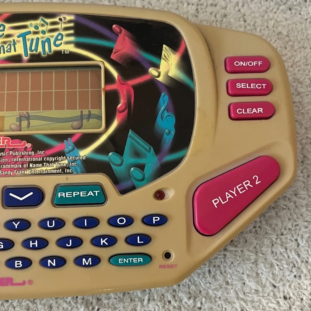 Name That Tune Handheld Game with country and western hits game Tiger toy